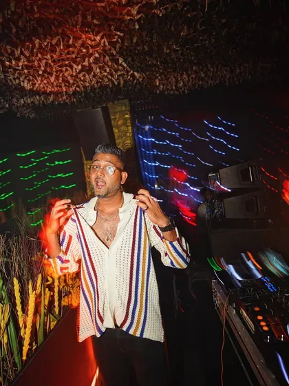 A candid moment of me feeling the beat during a set in Mumbai. The motion blur adds a dynamic, artistic feel to the shot.
