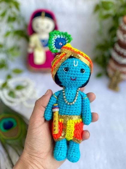 The divine couple, Radha and Krishna. I made this beautiful pair to celebrate the festival of Holi. Radha's lehenga and Krishna's turban are crafted with bright, festive colors.