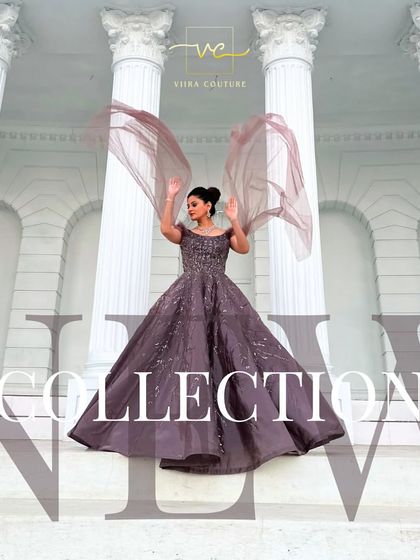 A dramatic shot of a model in a mauve ball gown with flowing cape sleeves. This is a true statement piece for any grand event.