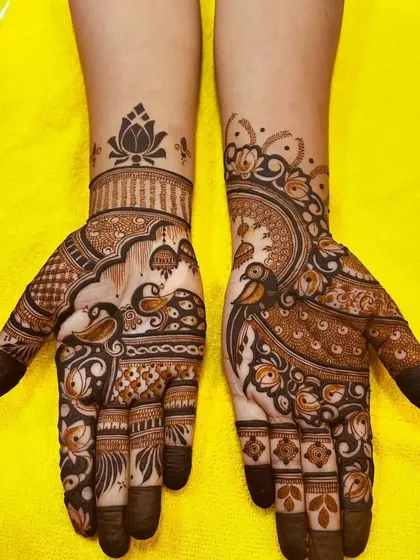 A more intricate design for Raksha Bandhan, with peacocks and lotus flowers. This is perfect for someone who wants a fuller look for the festival.