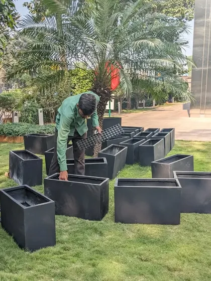 I am placing a drainage cell at the bottom of an FRP planter. This is part of our multi-layer base system to ensure excellent water drainage and prevent root rot.
