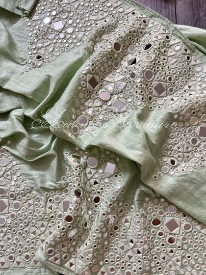 A view of the palazzo fabric, showing the texture and shimmer of the mirrorwork.