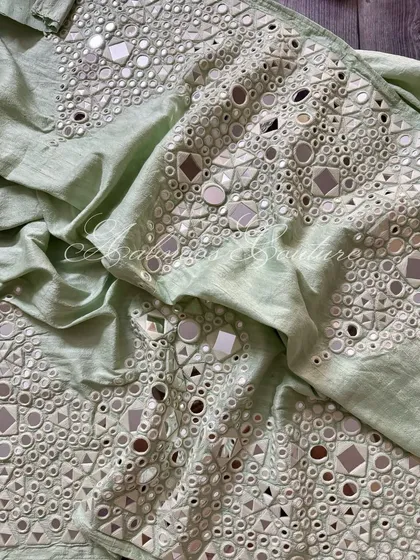 A view of the palazzo fabric, showing the texture and shimmer of the mirrorwork.