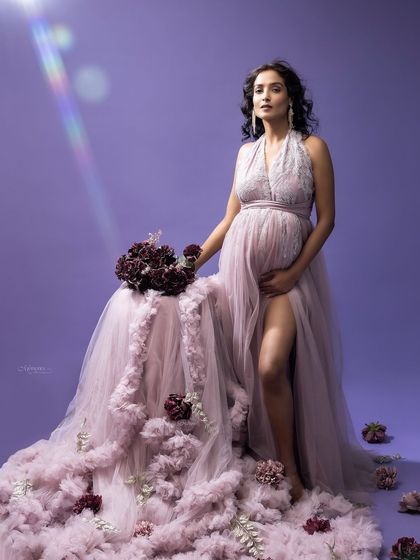 Embracing a monochromatic lilac palette allows emotion to shine. This soft, dreamy, and ethereal setup creates a moment suspended in time.