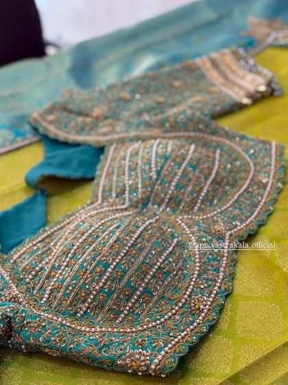 The front of the teal blouse, showing the padded bustier design.