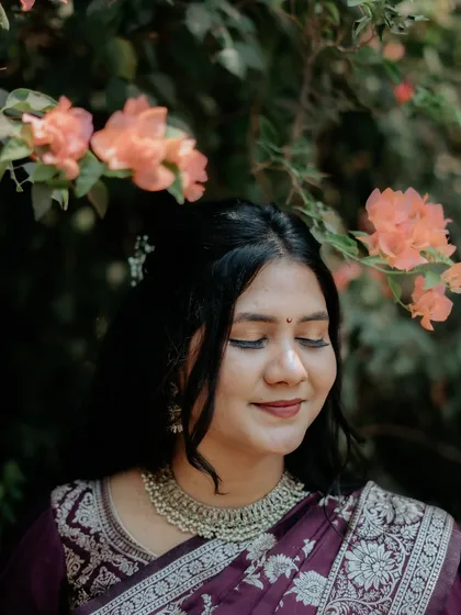 A serene, eyes-closed portrait of the bride-to-be, capturing a moment of quiet happiness.