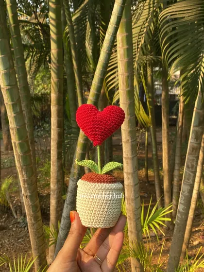 A simple red heart that says it all. I love taking my creations outdoors to capture them in the sunlight. This handmade heart pot is a perfect, lasting gift for someone you love, no water needed.