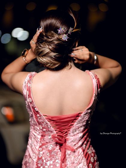 A professionally shot photo of the reception updo, highlighting the intricate details and how the hair accessories catch the light.
