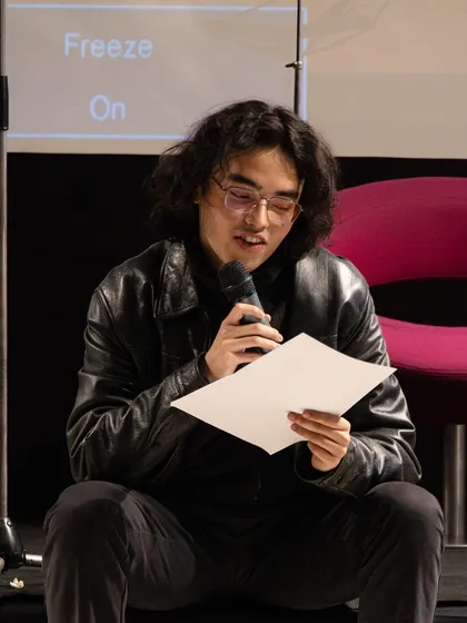 A young poet reading his work at the showcase. We provide a supportive environment for emerging artists to experiment and find their voice.