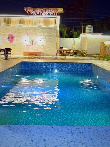A clear view of our sparkling clean pool at night. The underwater lights give the water a beautiful blue glow, making it an inviting sight even if you're not swimming.