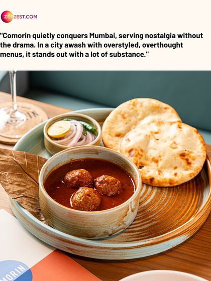 A bowl of our Keema Kofta Curry, served with a side of naan. The meatballs are tender and the curry is rich and aromatic, a truly comforting meal.