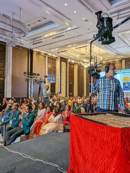 A view from the side of the stage, showing my complete sand art setup with the camera and projector.