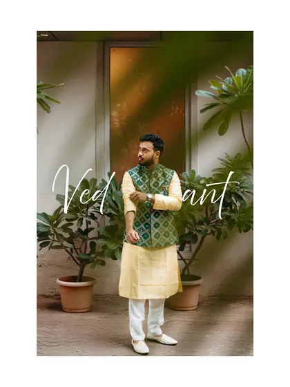 A stylish portrait of our groom, Vedant, looking sharp in his traditional kurta and jacket.