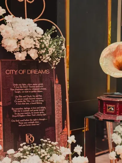 The welcome signage for the "City of Dreams" event, complete with a vintage gramophone, set the tone for a night of glamour and celebration.