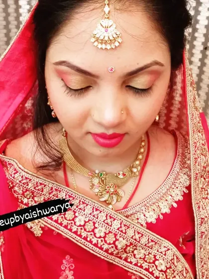 A beautiful reception look for a bride in a traditional red lehenga. I created a soft gold and pink smokey eye with a matching pink lip to create a romantic and timeless bridal style.