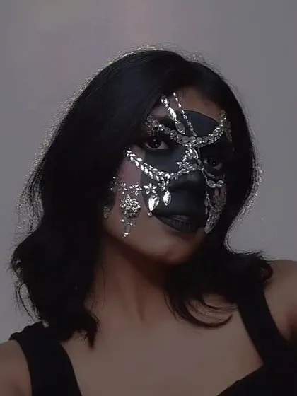 Playing with a blue filter on my rhinestone mask look. I love how the light catches the gems and creates a cool, futuristic vibe.