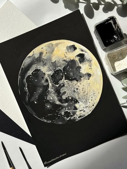 A realistic painting of the moon on black paper. I used white and yellow gouache to capture the craters and texture of the lunar surface.