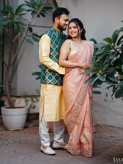 A classic couple portrait. The bride's soft peach look is elegant and timeless, a perfect choice for her engagement.