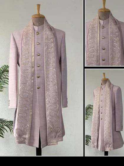 A classic Matka Silk Achkan in a soft lavender, paired with a paisley embroidered dupatta. A stylish and sophisticated choice for festive occasions.