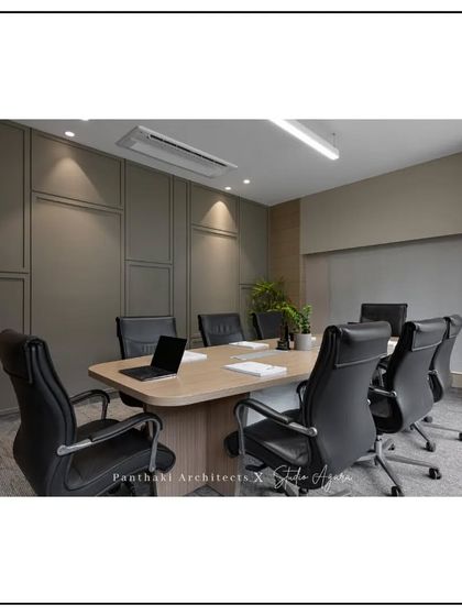 A sleek and professional conference room designed for important meetings. The neutral color palette, comfortable seating, and excellent lighting create a focused and distraction-free environment.