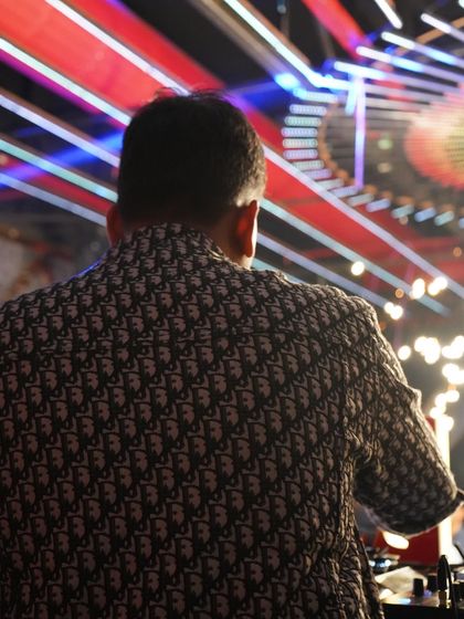A shot from behind the console, facing a stunning light display. The visuals are a huge part of the experience, and I love performing in clubs with top-tier production.