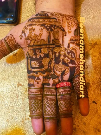 Mehandi is for grooms too! This design features a detailed doli scene on the palm, a perfect way for the groom to celebrate the wedding festivities.