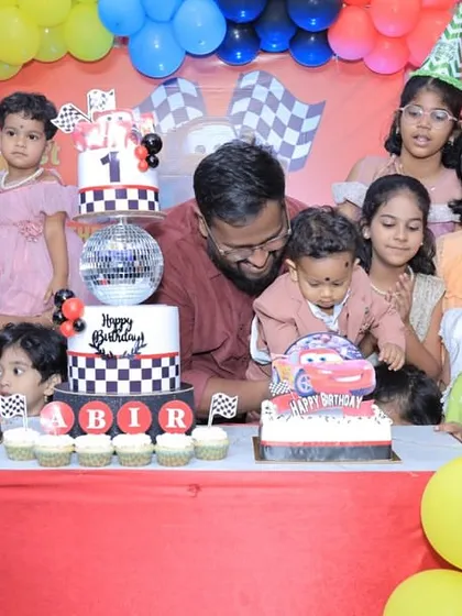 The birthday boy gets a closer look at his Lightning McQueen cake. These are the moments we bake for.