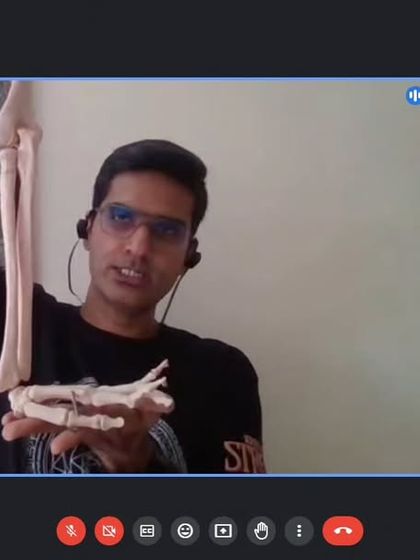 In our online anatomy sessions, we use skeletal models to demonstrate the biomechanics of joints like the elbow and wrist. This knowledge is crucial for teachers to provide safe, individualized alignment.