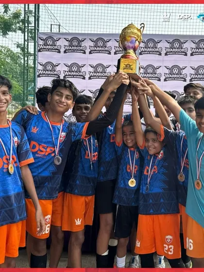 Lifting the trophy high. The pure emotion of our Under 15 team after being crowned champions.