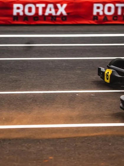 Two karts side-by-side at the starting line, ready for the lights to go out.