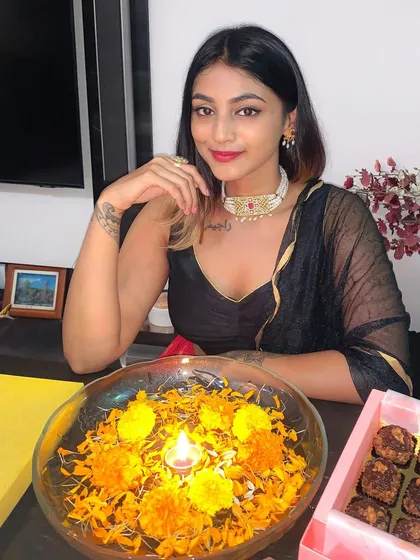Another portrait from my Diwali celebration. The classic black saree is a versatile piece that can be styled for any festive occasion.