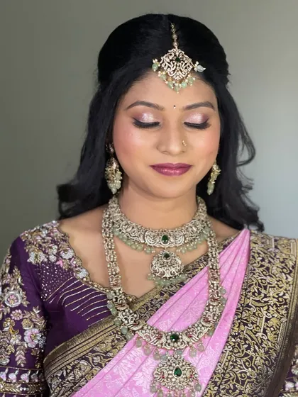 A detailed shot of the shimmery eye makeup and soft pink lip, a perfect combination for an elegant evening look.