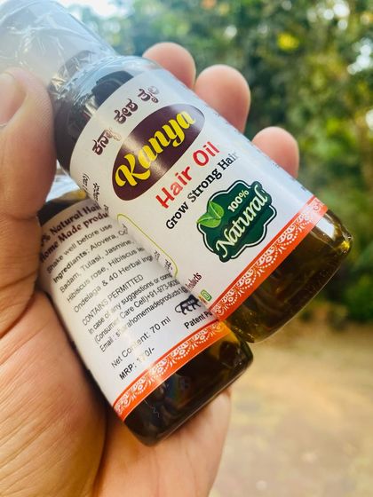 This angle shows the back of the label, where you can find the list of ingredients and usage instructions for my herbal hair oil.