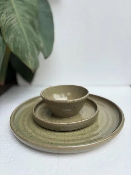 Our complete Green Celadon dinner set. This three-piece place setting, including a dinner plate, side plate, and bowl, is perfect for elevating your everyday meals. We can create sets like this in any of our custom glazes.