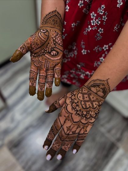 A gorgeous mehendi design for the Teej festival. This style features a mix of bold paisleys and delicate floral patterns, perfect for celebrating this special occasion.