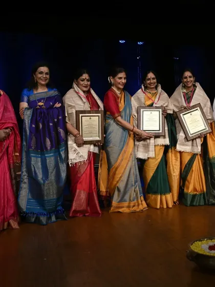 A group photograph from the inauguration of the 68th Margazhi Mela at Krishna Gana Sabha, with fellow awardees and dignitaries.