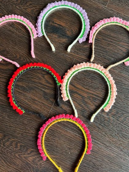 Another view of the colorful handmade hairbands, perfect for elevating your little one's outfit and bringing a smile to their face.