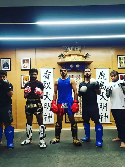 The full squad ready for striking practice. Training with a team keeps you motivated and accountable.