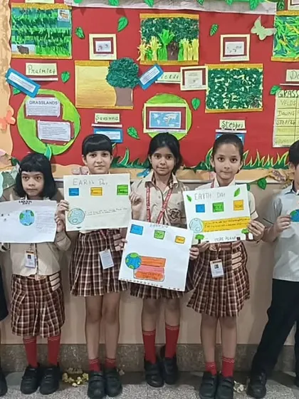 Students proudly display their posters and artwork during the Earth Day celebration, showing their commitment to a sustainable future.