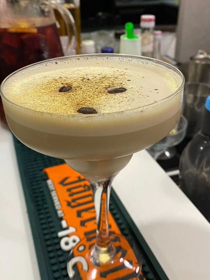 A beautifully crafted Espresso Martini with a rich, frothy top. We specialize in creating premium cocktails that taste as good as they look, perfect for any celebration.