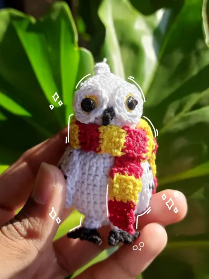 A custom Hedwig keychain, complete with a Gryffindor scarf! This was a special request, and I think she turned out super cute. The little embroidered details on her feathers add a nice touch.