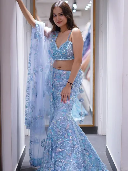 Another look at this ethereal blue fishtail lehenga, showing off its stunning silhouette.