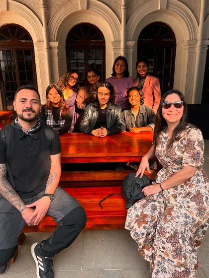 Mentors and participants from the 'Verse and Voice' workshop posing together. We foster a close-knit environment where mentors and students build lasting connections.