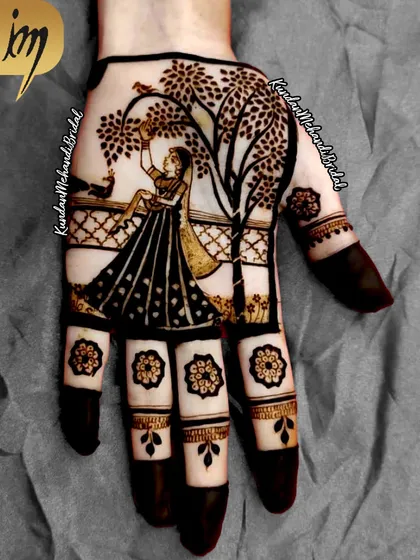 This unique Karwa Chauth design shows a woman on a swing, looking at a bird, symbolizing the wait and the joy of the festival.