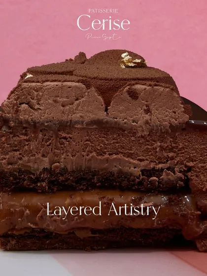 Layered Artistry. This cross-section of the Midnight Sun shows the distinct, perfectly crafted layers that define a true entremet.