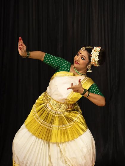 A dynamic pose from a student's solo performance, showcasing her command of the Mohiniyattam form.