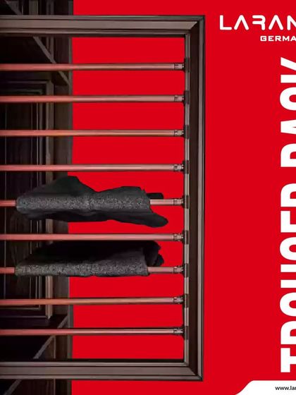 This trouser rack, shown in a rich wood-toned wardrobe, exemplifies how my accessories can be integrated into various design styles while providing robust functionality.