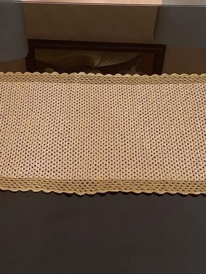 The simple stitch and clean border of this gold runner make it a perfect backdrop for any centerpiece.