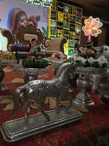 Silver horse and other animal props adding variety to the traditional offering display.