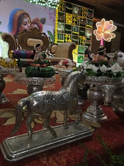 Silver horse and other animal props adding variety to the traditional offering display.
